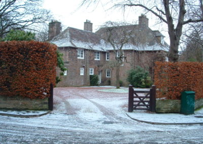 An Arts and Crafts House front garden and driveway