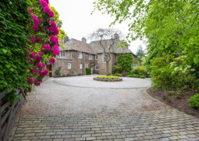 An Arts and Crafts House front garden and driveway