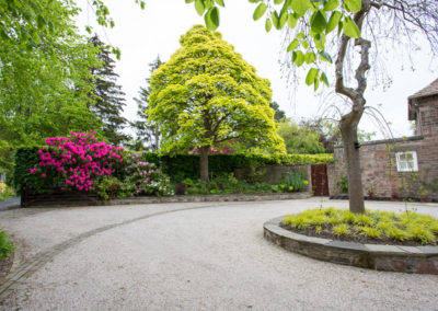 An Arts and Crafts House front garden and driveway