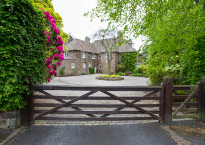 An Arts and Crafts House front garden and driveway