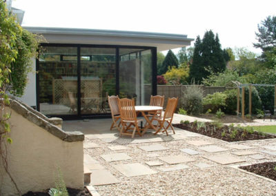 A Flowing Family Garden - seating area outside the new garden room