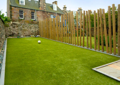 A Family Garden Challenge - with different functional areas including a swing set and football ground