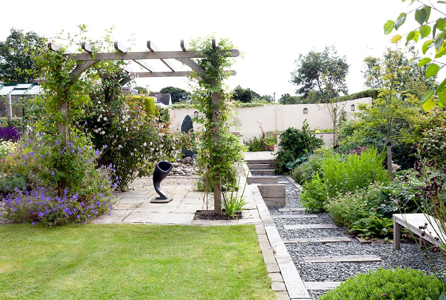 Panoramic refuge - pergola and contemporary features with mixed planting Garden Design - a multi roomed garden with contemporary sculpture