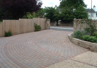 A Linear Focus - paved drive and raised beds which elevate gradually