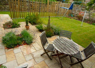 A Family Garden Challenge - with different functional areas including a swing set and football ground
